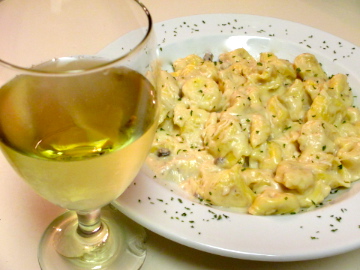 This date night recipe of cheese tortellini in a creamy mushroom alfredo is best served with a glass of white wine and enjoyed over candlelight.  