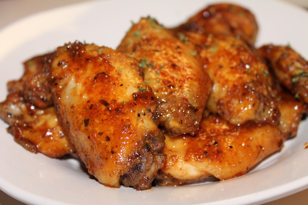 Honey mustard glazed chicken wings with basil flakes and a sweet honey sauce