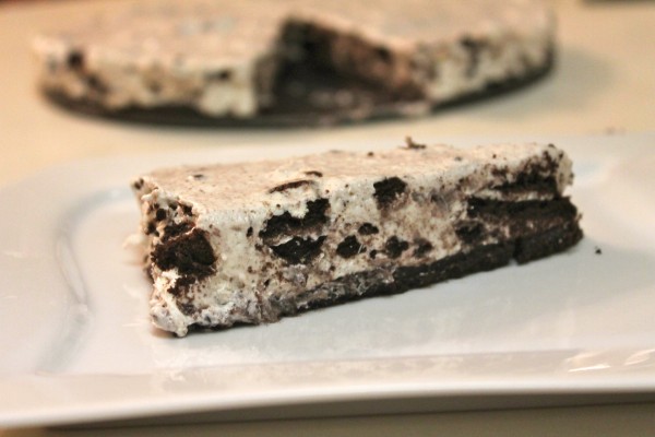 A slice of No Bake Oreo Cheesecake on a white plate. 