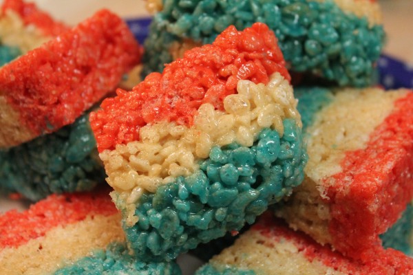Layered red, white, and blue colored Rice Krispies treats squares are a sweet and tasty 4th of July treat.