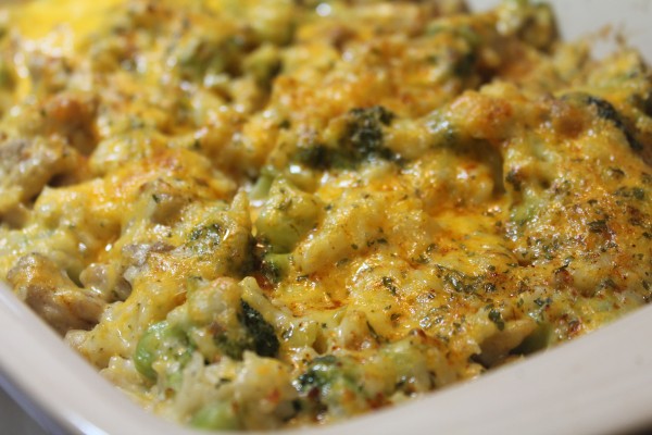 A baking dish filled with a creamy, delicious cheesy broccoli chicken and rice casserole - a super simple comfort food dinner that's fast and easy to make!