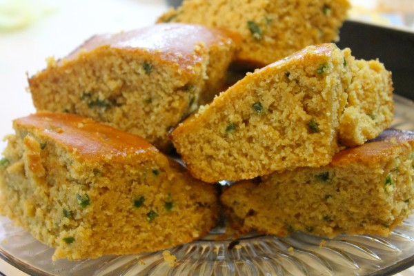 Slices of sweet and spicy honey jalapeno cornbread—a moist homemade cornbread with fresh diced jalapenos in every bite.