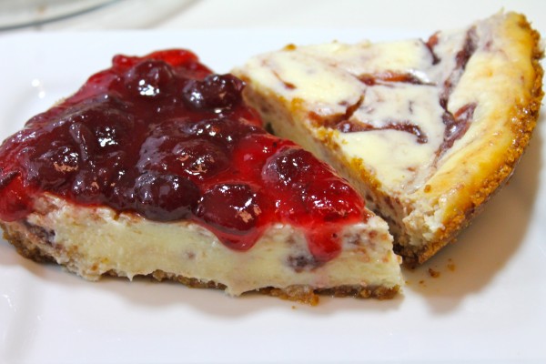 Homemade white chocolate cheesecake with a sweet cranberry sauce