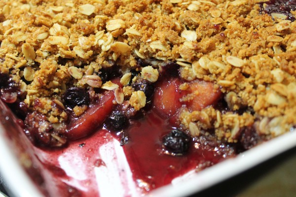 Sweet blueberry and peach cobbler with a crispy crumble topping