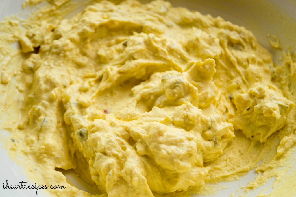 The creamy filling for Southern Deviled Eggs fills a white bowl. 