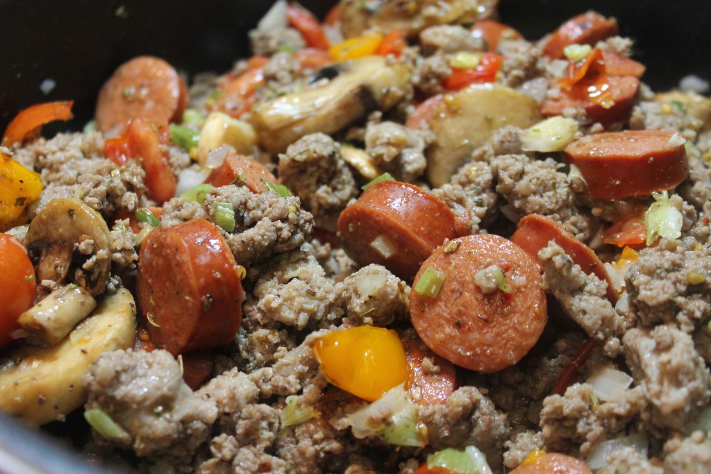 Saute the ground beef, sausage and vegetables together