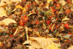 Spread the brisket and toppings over tortilla chips and top with cheese for the best brisket nachos around!