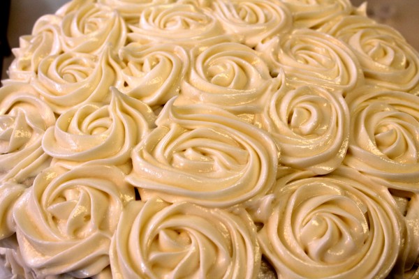 Cream cheese dressing made into rose swirls