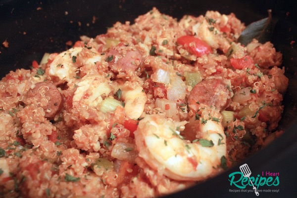 A close up of cooked quinoa jambalaya in a crock-pot. 