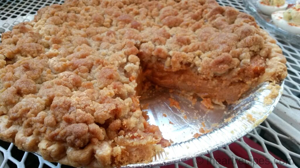 Creamy sweet potato pie topped with a crispy dutch topping