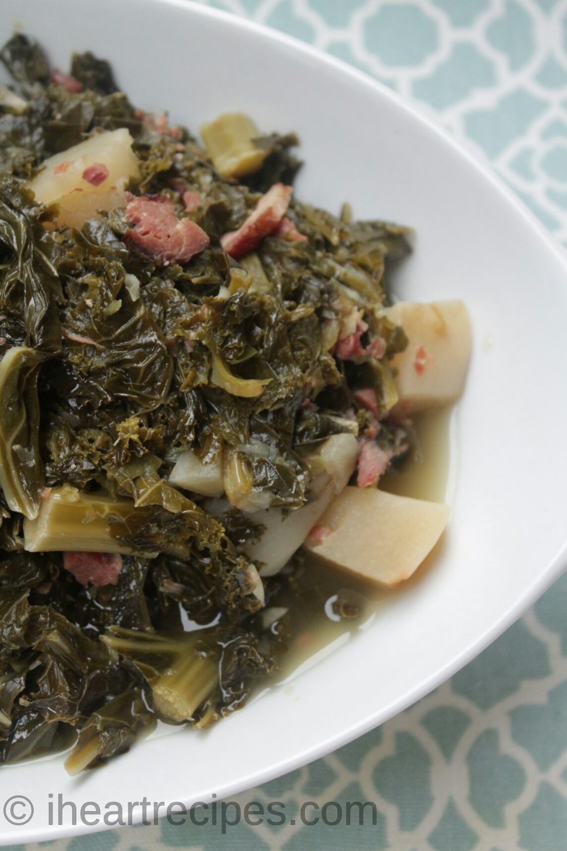 Southern-style mixed greens—a combination of kale, collard greens, and mustard greens, cooked with spices, onion, garlic, peppers, and bacon.