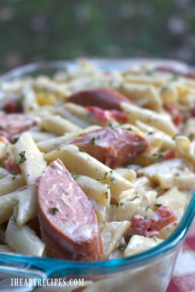 Savory sausage and tender pasta in a creamy sauce fill a glass baking dish. Using ingredients from the Dollar Tree, this Creamy Jambalaya Pasta is easy on the wallet. 