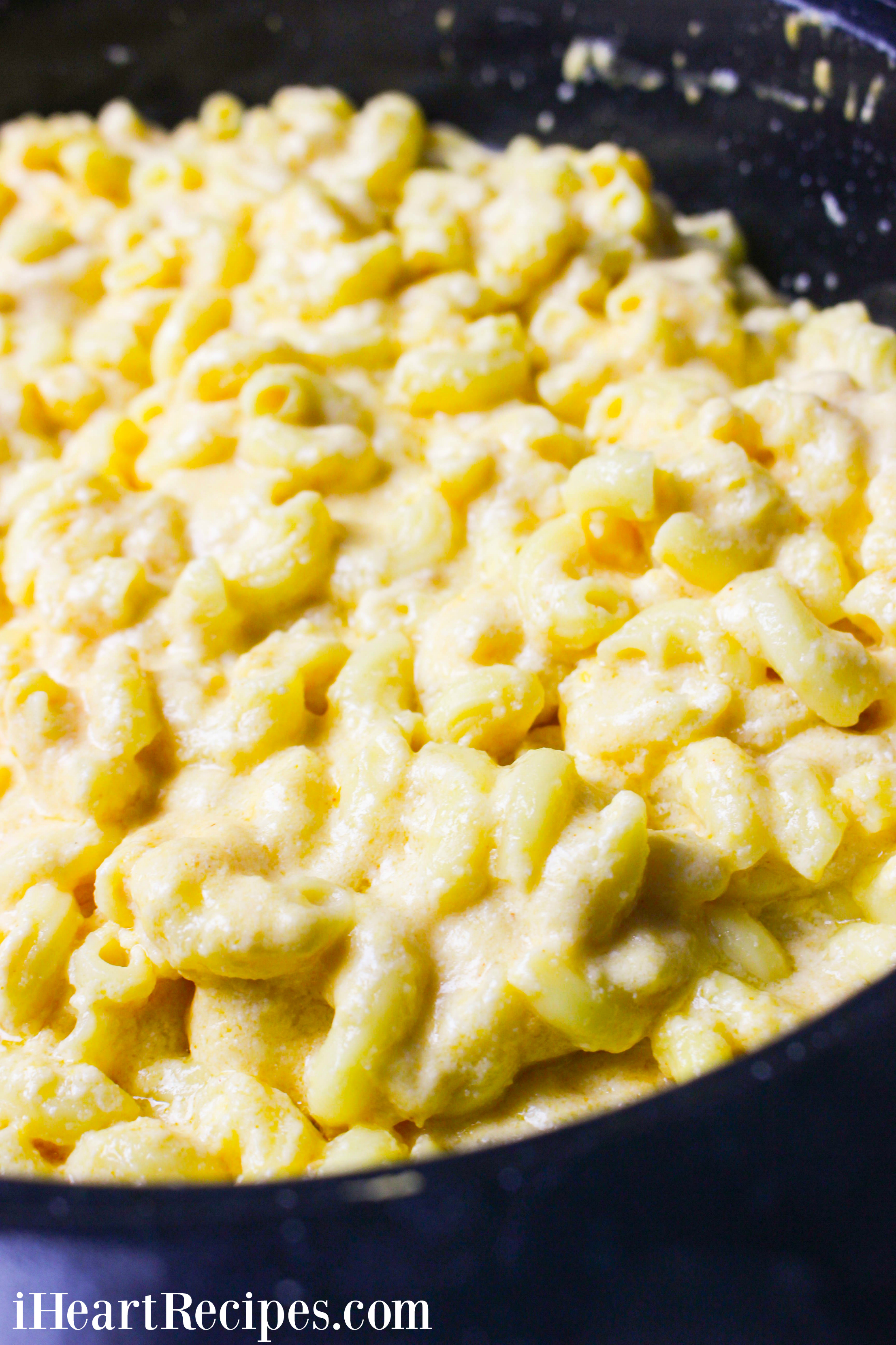 Cheesy and creamy mac and cheese cooking in a slow cooker. 