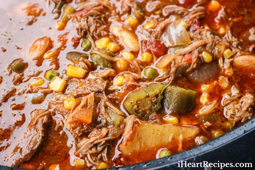 Colorful Brunswick Stew in a black pot. 