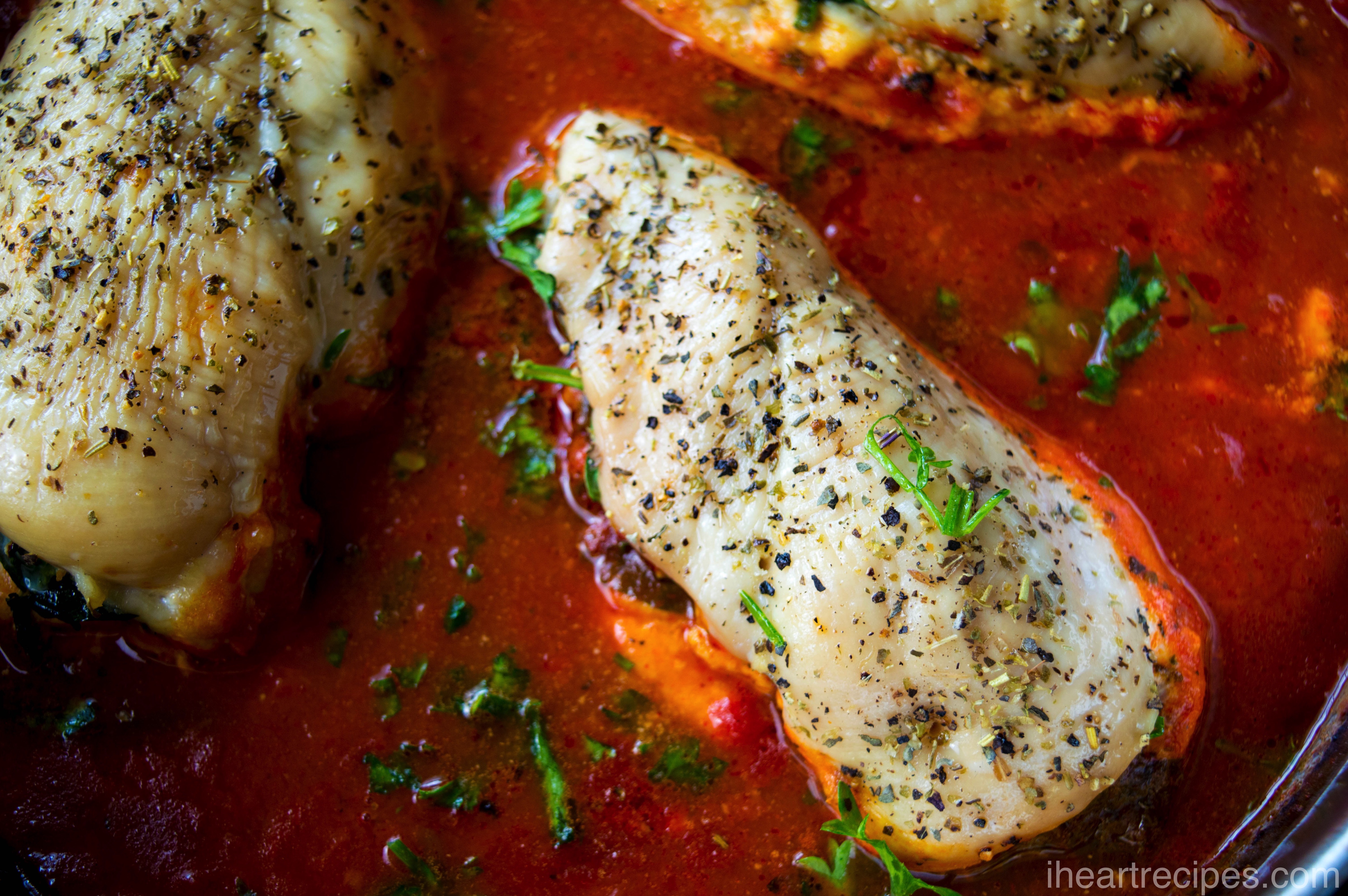 Tender stuffed chicken breast sprinkled with Italian seasoning simmering in hearty marinara sauce.