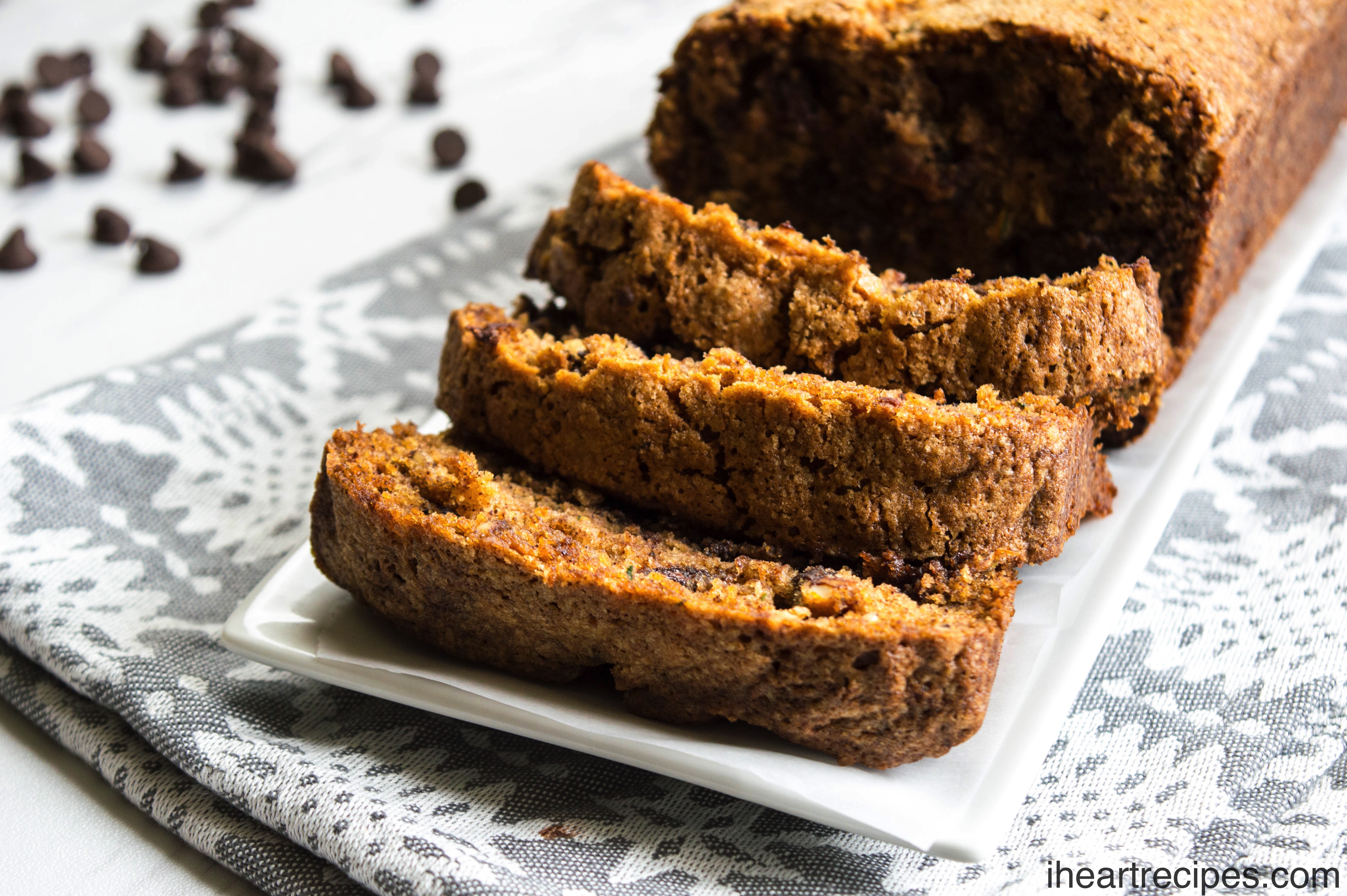 Sliced sweet zucchini bread served on a classic white platter. This is the perfect treat!