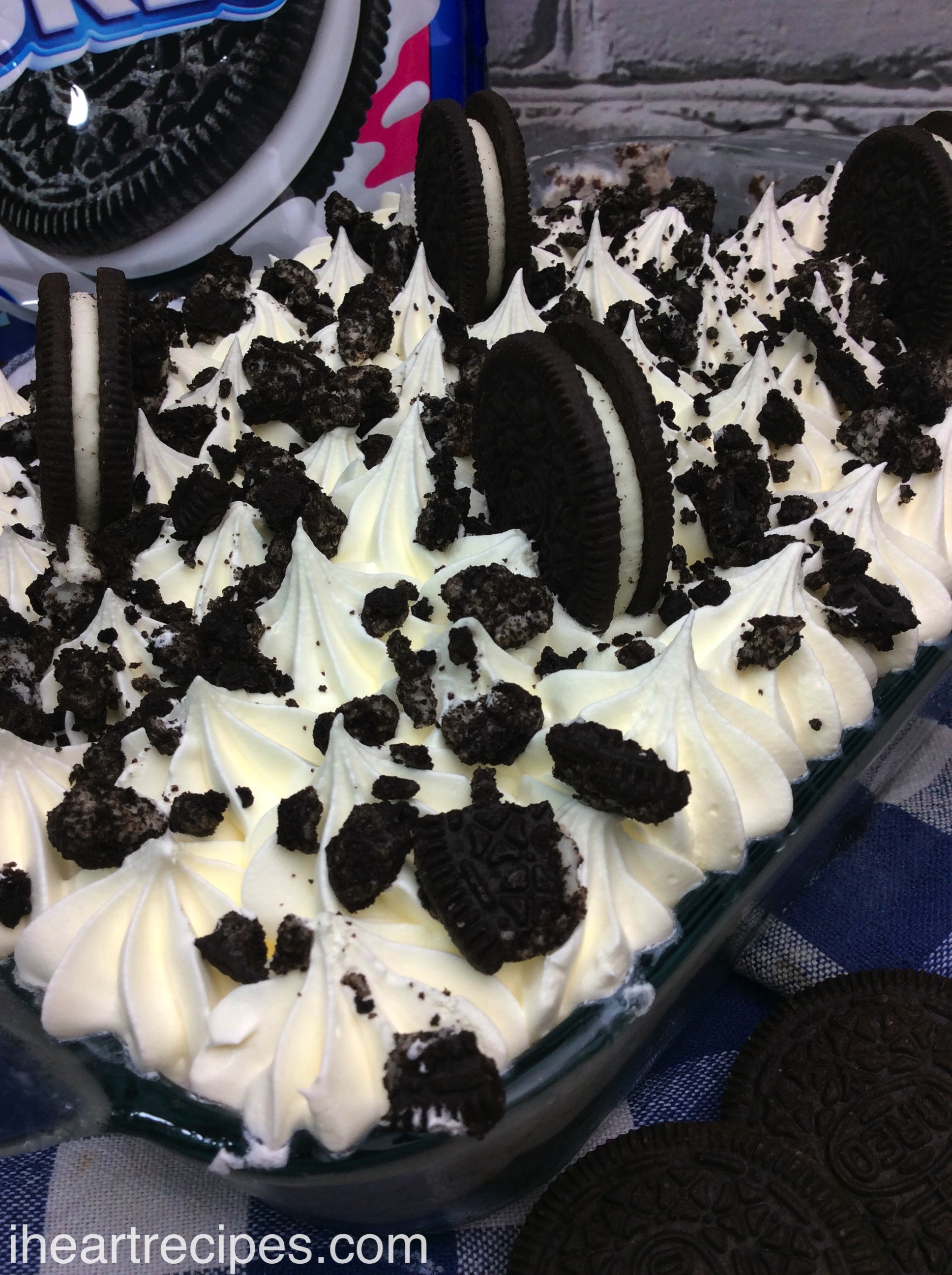 Creamy and fluffy homemade Oreo ice box cake served in a simple glass baking dish.