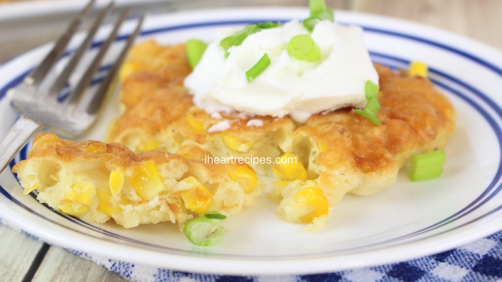 Sweet and crispy southern corn fritters are packed with whole kennel corn and topped with a refreshing dollop of whipped cream