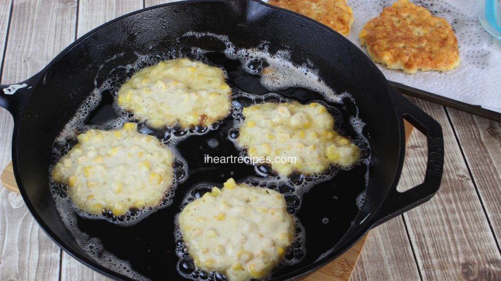 Crispy southern corn fritters fried in a cast iron skillet - the perfect side dish for southern meals.