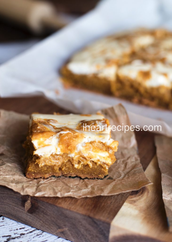 Try a slice of this soft and gooey pumpkin bar topped with cheesecake swirl!