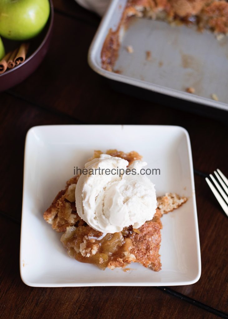 A delicious slice of apple cobbler topped with creamy vanilla ice cream