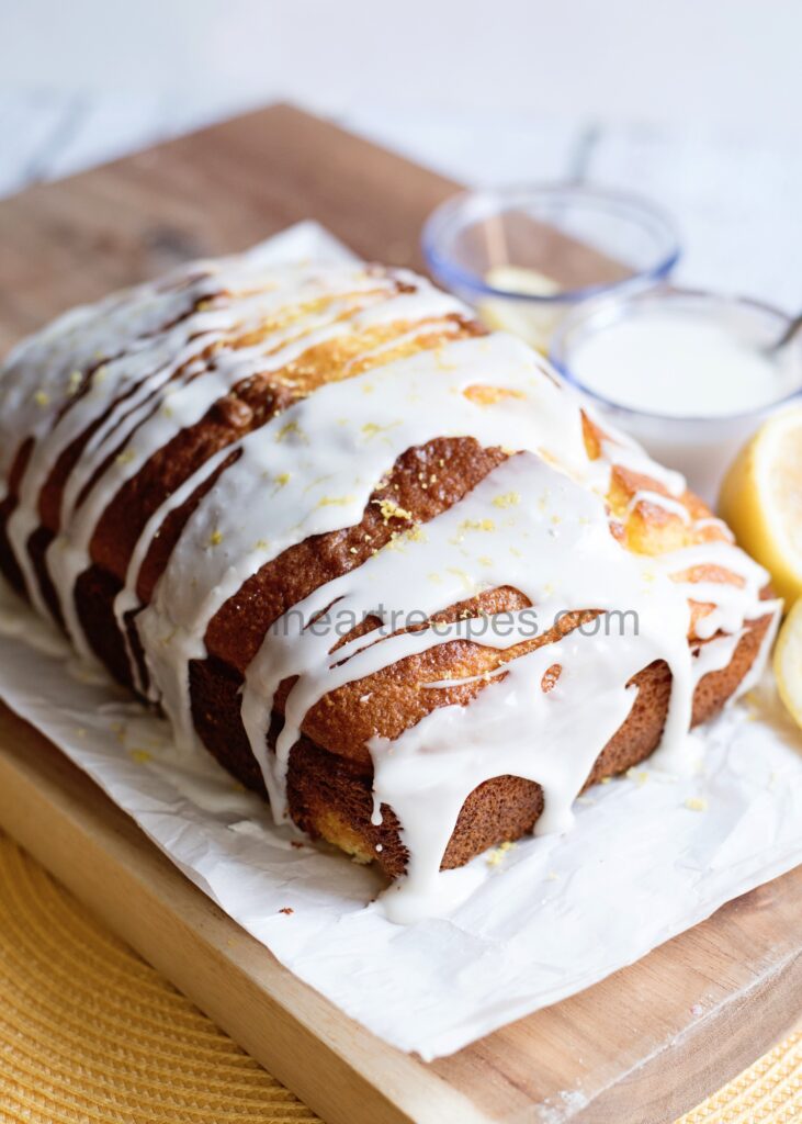 Lemon Loaf Pound Cake drizzled with white glaze. 