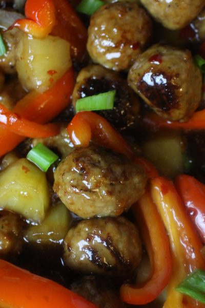 Meatballs with sweet & sour sauce, pineapple chunks, onions, and sweet red peppers.