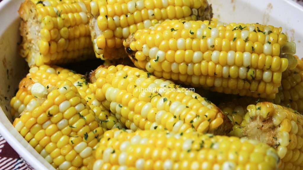 Tender and hot oven baked corn on the cob right out of the oven!