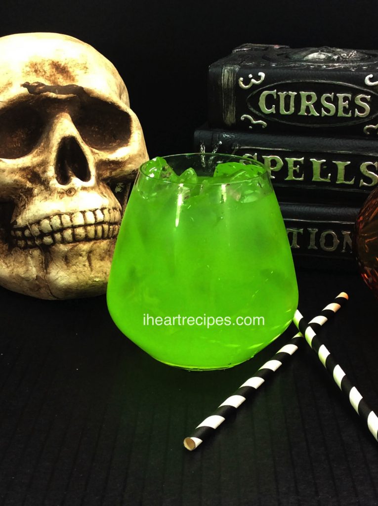 This adults-only Embalming Fluid Cocktail is set against a spooky backdrop.