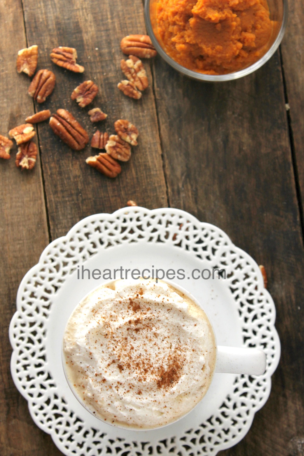 This pumpkin spice latte is topped with sweet whipped cream and dusted with pumpkin spice!