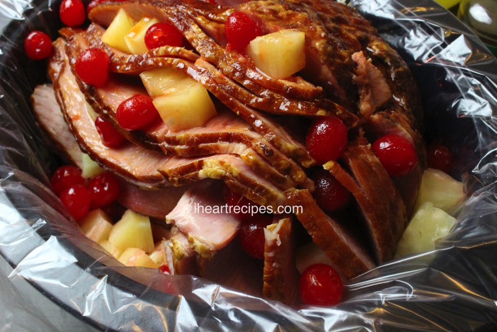 A tender spiral cut ham slow cooked in the crock post with pineapples and cherries.