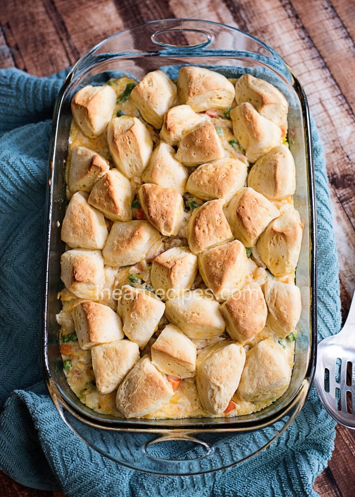 A new twist on classic chicken pot pie, this pot pie casserole is topped with butter biscuits.