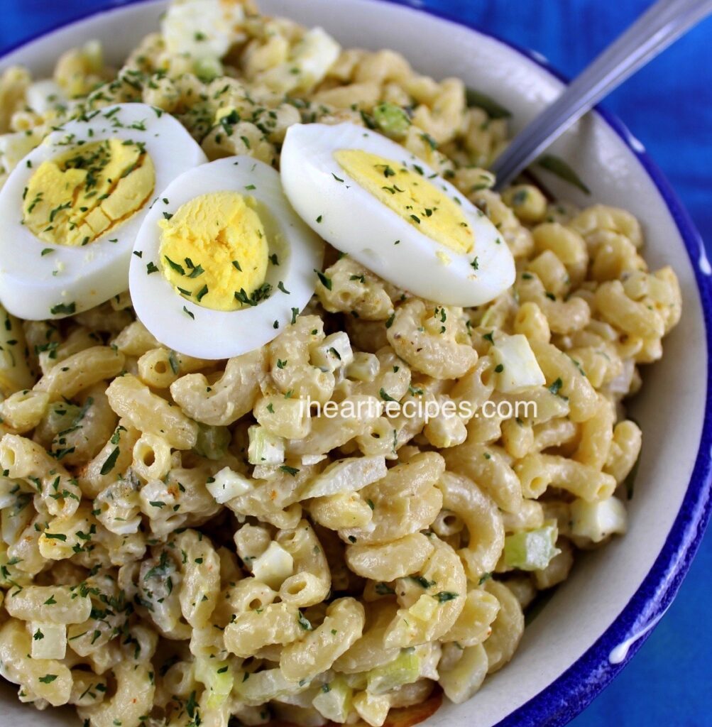 Learn how to make this super simple deviled egg pasta salad with creamy dressing, hard-boiled eggs, dried parsley, and more.