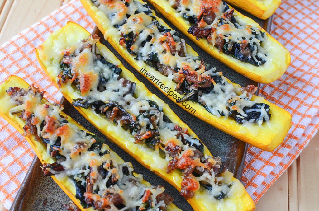 Delicious and tender squash boats with sausage and swiss chard are a hearty, easy meal that's perfect for fall