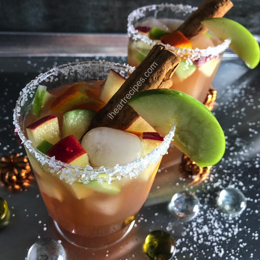 Festive Thanksgiving margaritas are made with a tangy spiced apple juice, apples, and of course, cinnamon sticks!