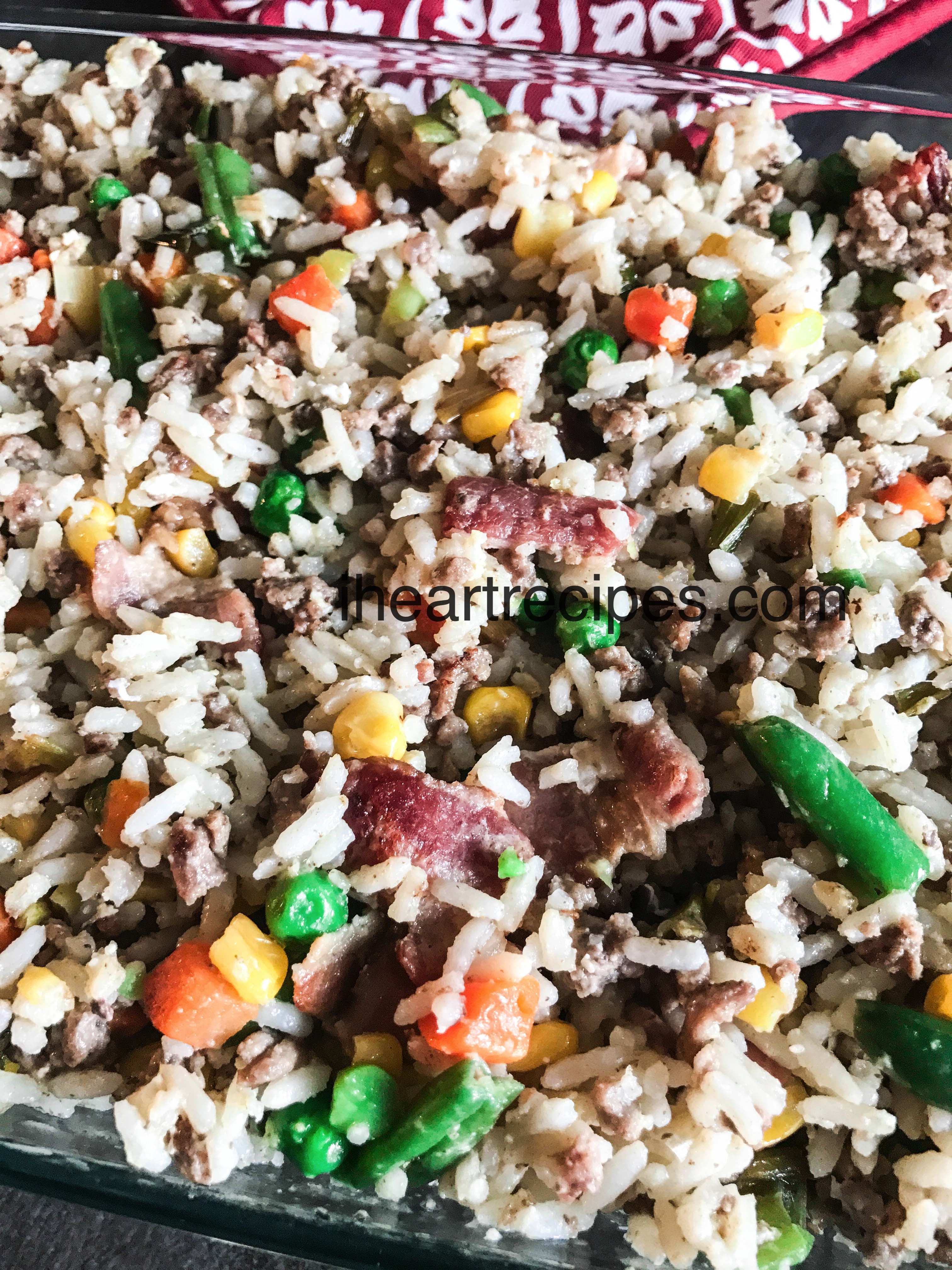 Bacon, carrots, corn, and green beans are just a few of the delicious ingredients in this poor man's fried rice.