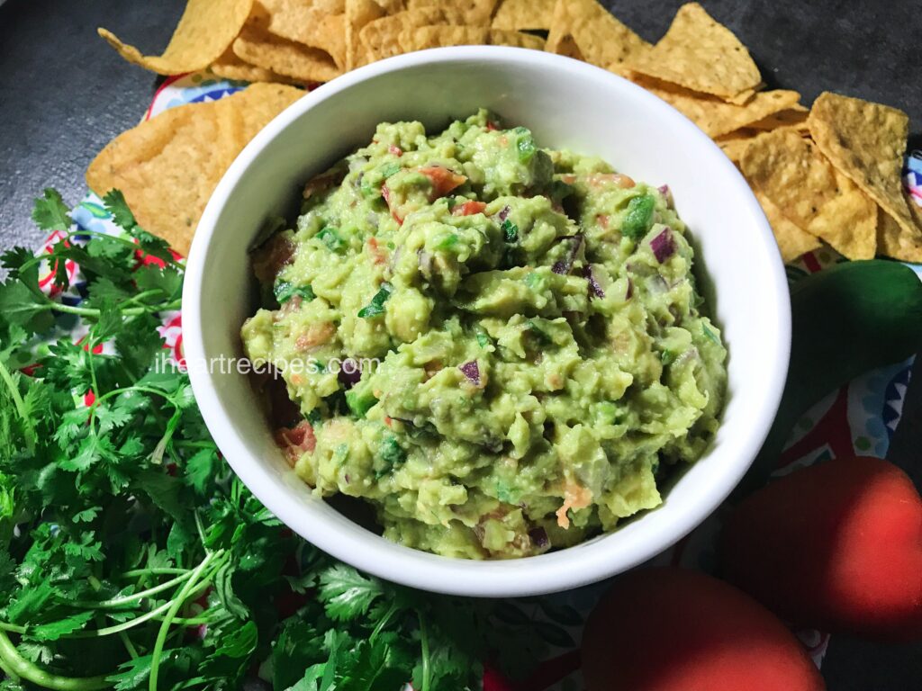 Serve a bowl of easy homemade guacamole alongside chips and garnishes! 