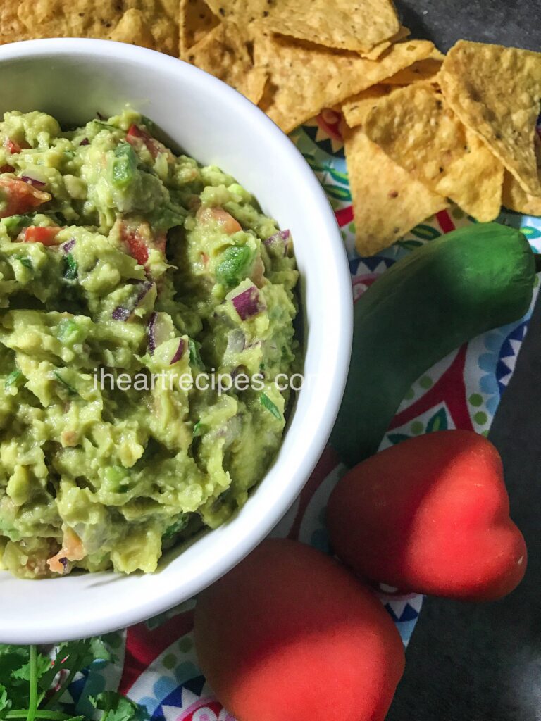 Serve this easy, delicious guacamole alongside chips, and garnish with fresh veggies and herbs for an eye-pleasing arrangement!