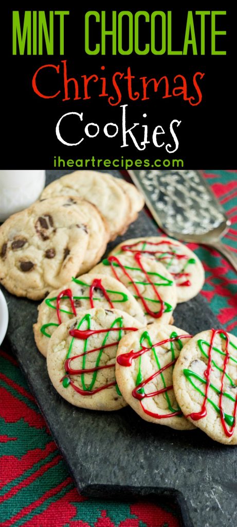 Two semi-stacked rows of Mint Chocolate Christmas Cookies on top a dark grey marble serving platter. A glass of milk and an etched silver serving utensil lay nearby.