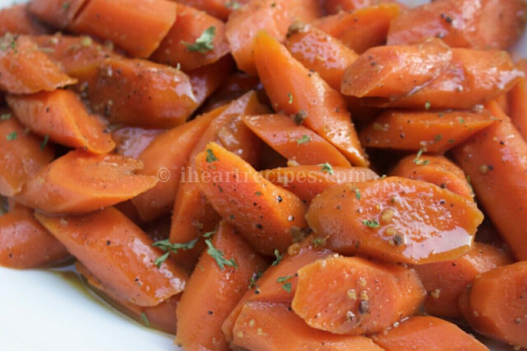 Sliced, delicious, tender, roasted carrots glazed in maple sugar and chai with peppercorns.