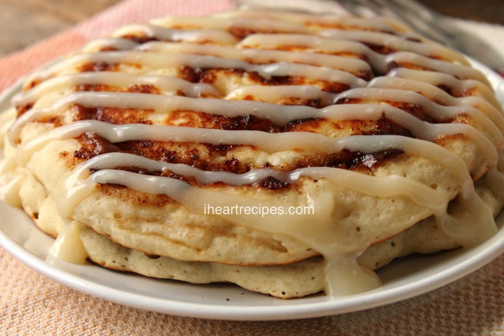 Cinnamon Roll Pancakes with Cream Cheese Icing is a decadent breakfast!