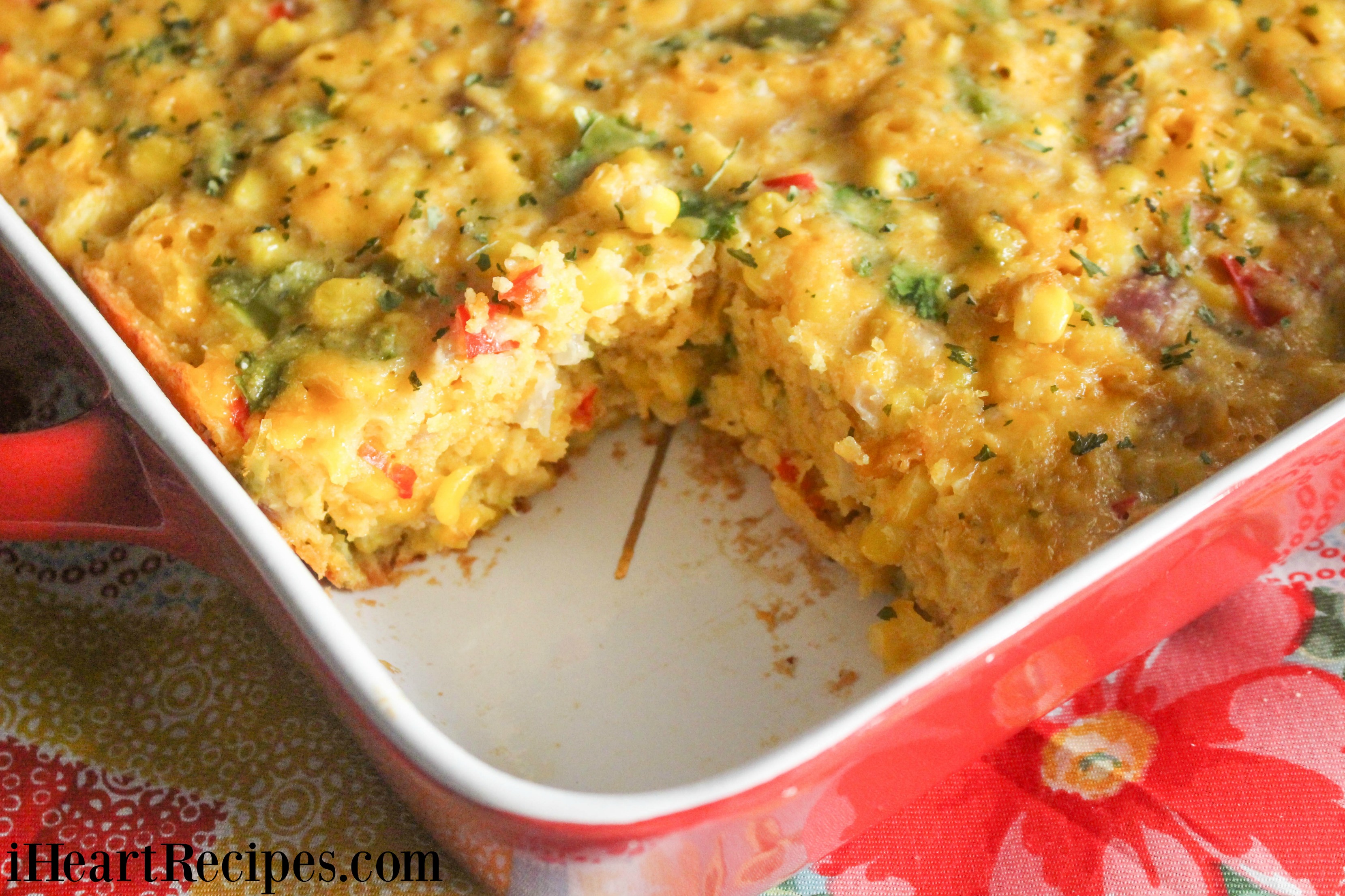 Creamy tex mex corn casserole served right out of the red baking dish. This casserole is packed with flavor!