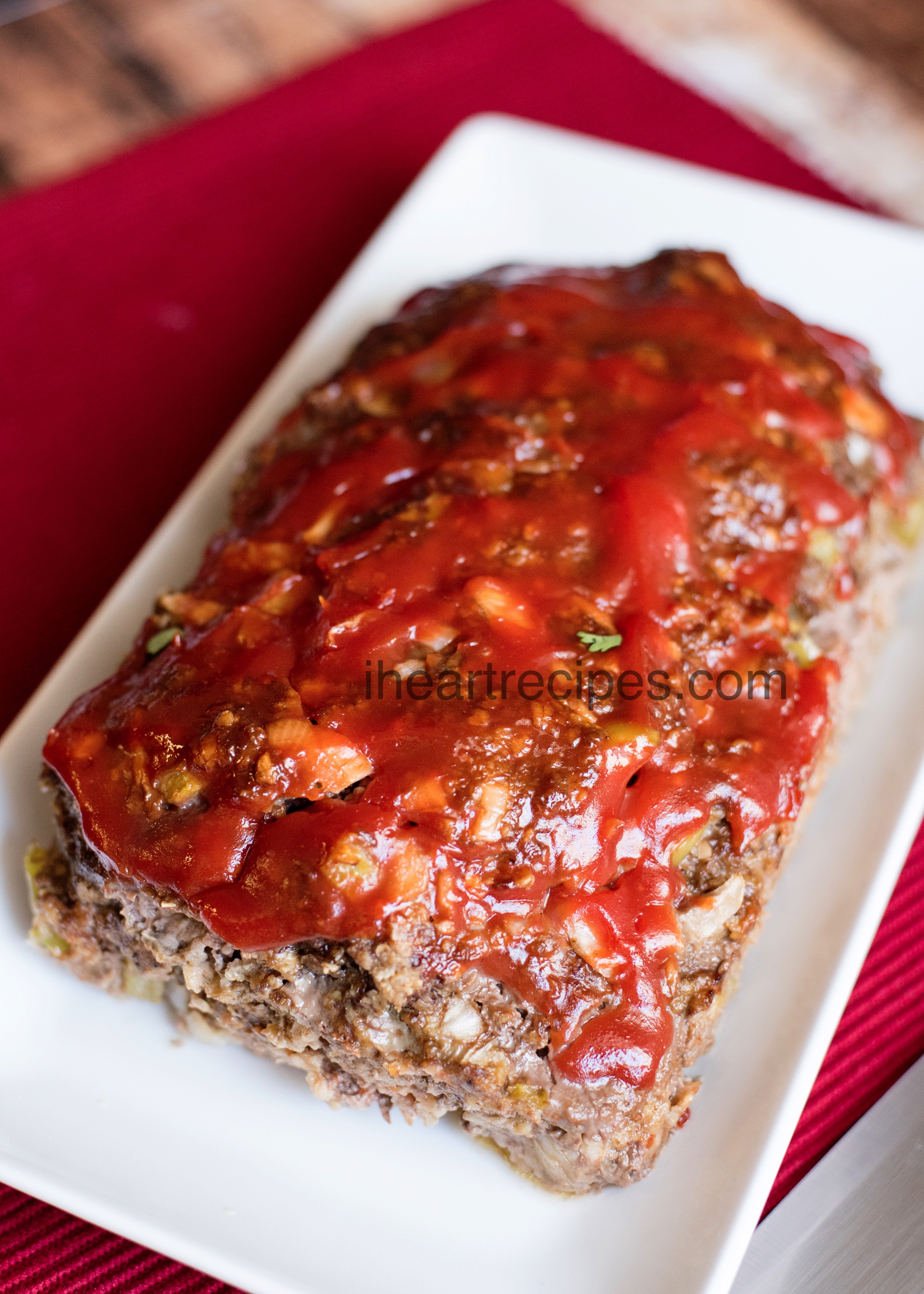 Moist and tender meatloaf served on a simple serving platter is the star of the show!