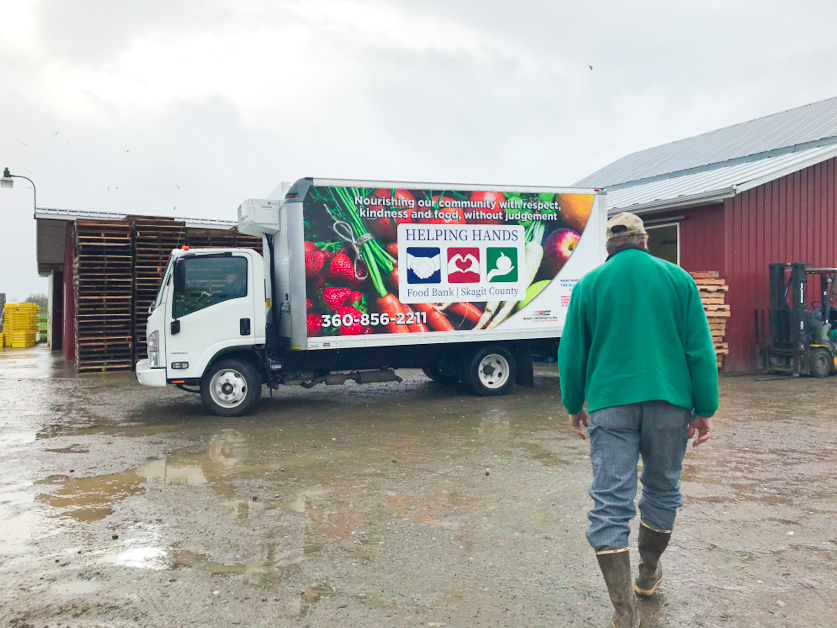 Mr. Ray takes us on a tour of a local farm in Washington, showing us the Helping Hands food bank truck and barn.
