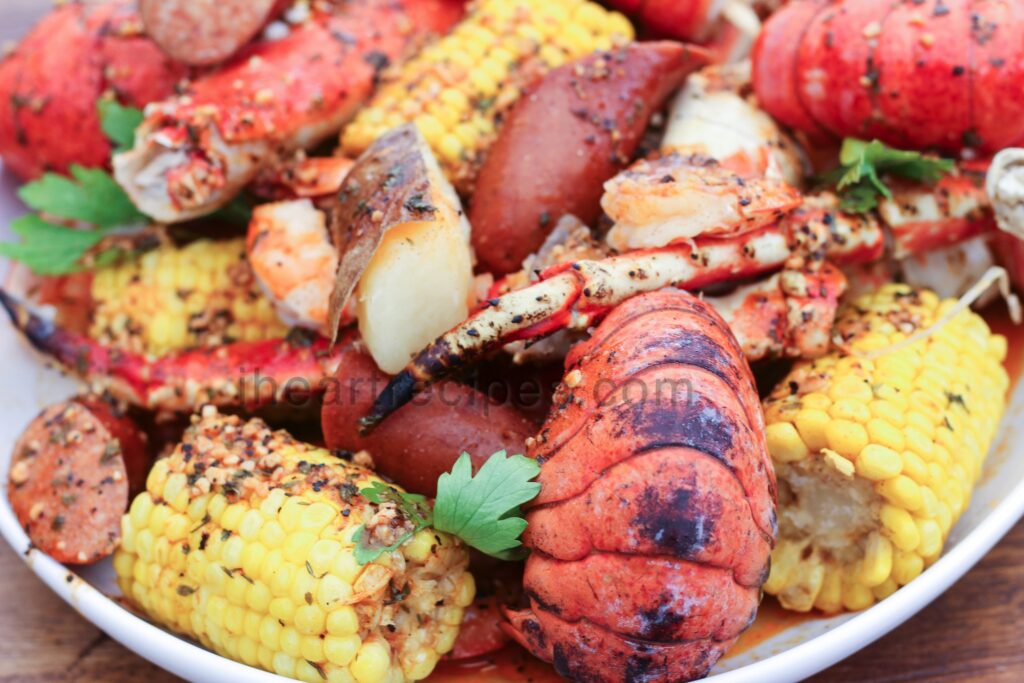 This delicious seafood boil is made with corn on the cob, lobster tails, crab legs, sausage, and more