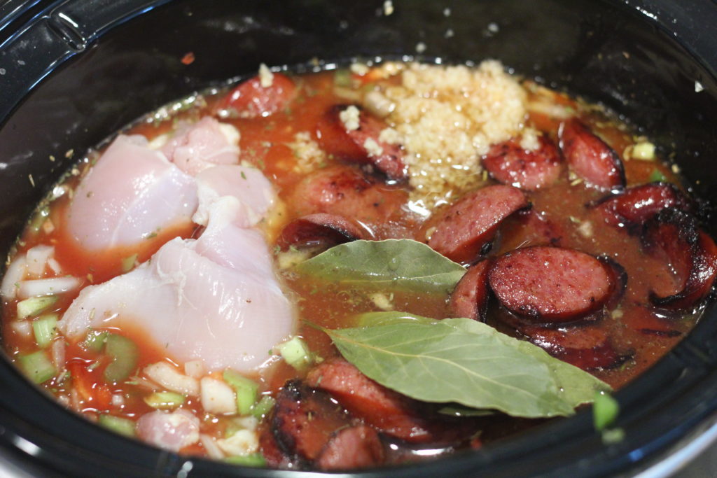 Dump all the ingredients for this chicken and sausage jambalaya into the slow cooker and set to cook for a simple, stress-free dinner