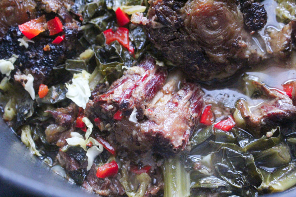 Fall-ff-the-bone tender smoked ox tails pair perfectly with classic southern collard greens