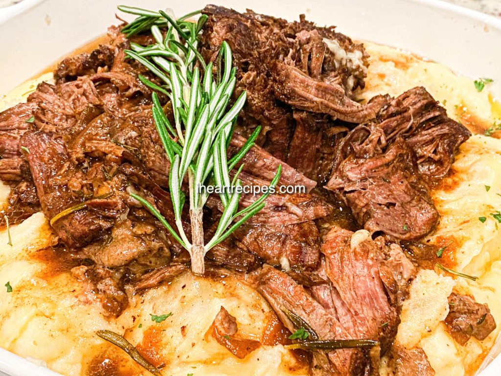 Tender beef roast smothered in a hearty gravy and served with herb mashed potatoes