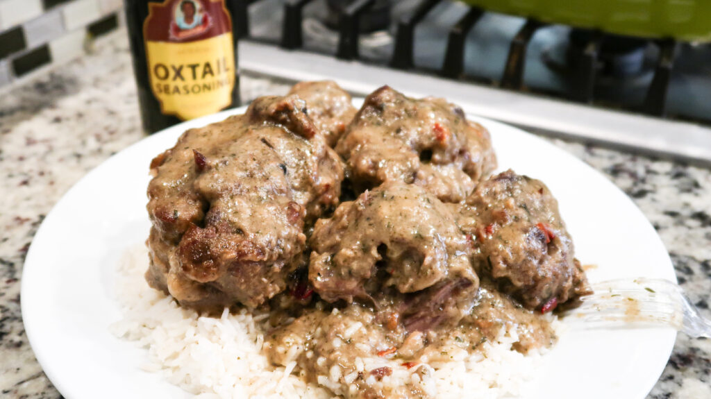 These fork-tender oxtails are smothered in a rich gravy and seasoned with the perfect touch of oxtail seasoning mix.