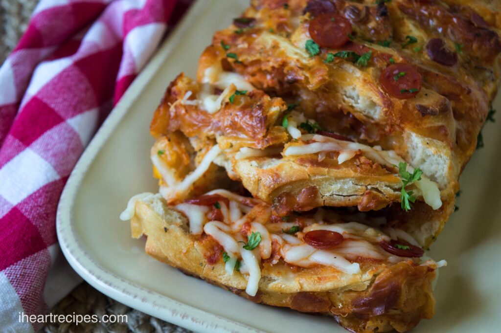 Pepperoni pull-apart bread stuffed with melty cheese, spices, and mini pepperonis.